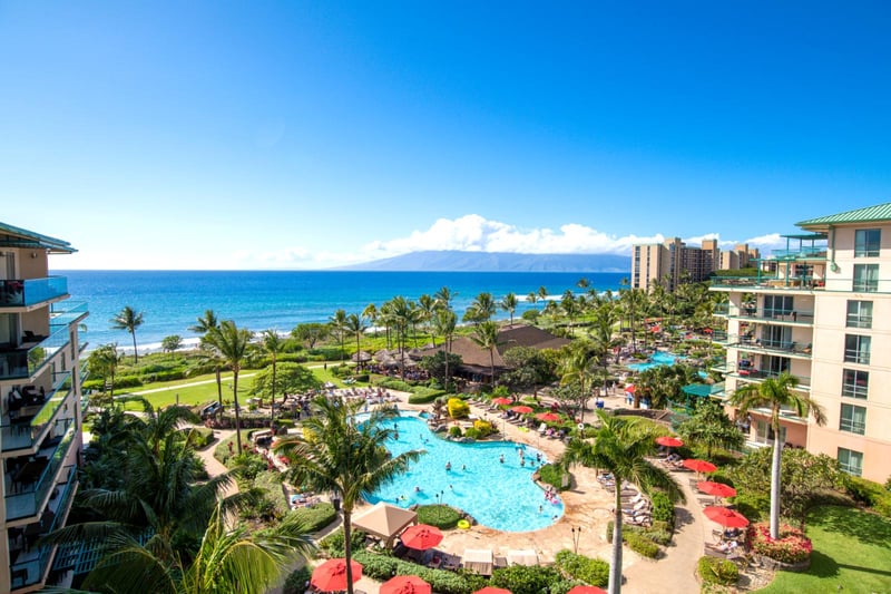 Resort paradise with ocean views, pools, palm trees, tropical bliss. HKH-609
