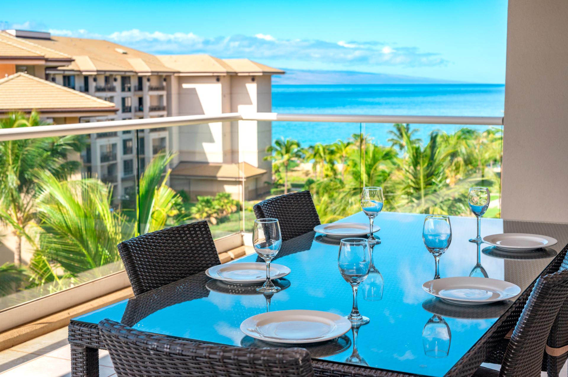 Elegant lanai dining with ocean views and tropical island breeze.