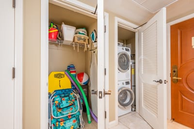 Convenient entry closets with beach gear and in-unit washer dryer.