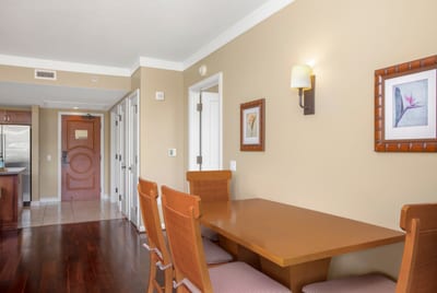 Warm dining nook with tropical artwork and modern resort ambiance.