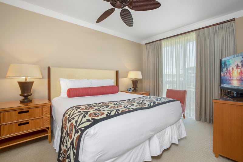 Tranquil bedroom retreat with tropical charm and soft natural light.