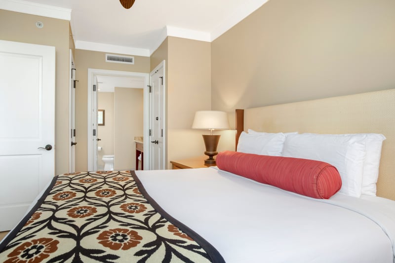 Cozy bedroom with vibrant accents and ensuite bathroom access.