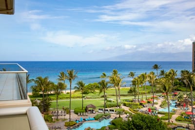 Tropical paradise with ocean views, palm trees, and luxury pools.