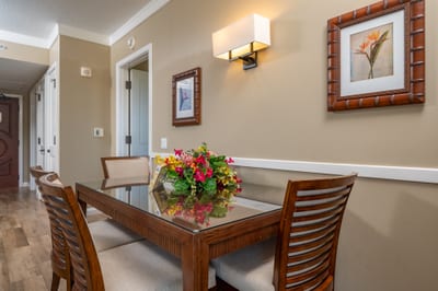 The dining area features seating for four, ideal for quiet meals at home