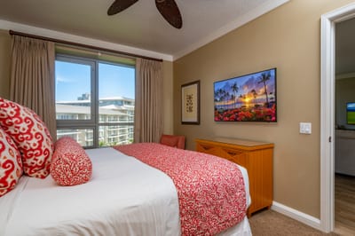 The master bed features a king size bed and flat screen TV