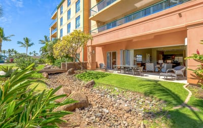 Tropical ground-floor retreat with open lanai and lush landscaping views.