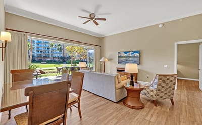 Spacious living and dining area with stunning resort garden views.