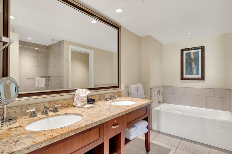 Luxurious bathroom with soaking tub, double vanity, and elegant finishes.