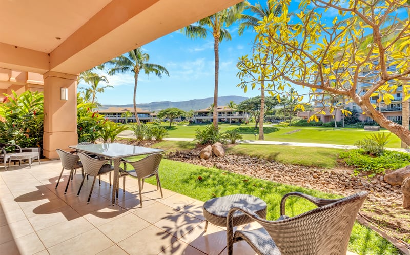 Tranquil patio view with lush greenery and mountain backdrop serenity. HKK-104