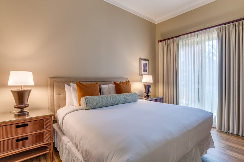 Elegant bedroom retreat with warm lighting and luxurious, inviting decor.