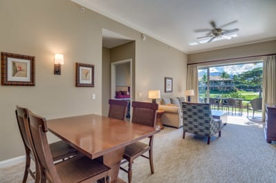 Spacious interior with dining, lounge, bedroom, and scenic lanai.