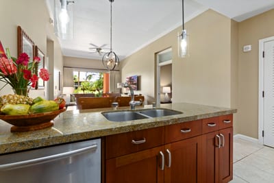 Fresh tropical flavors meet modern comfort in this island kitchen escape.