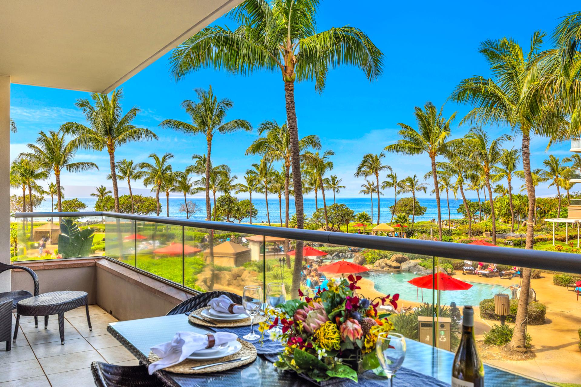 Dine on the balcony surrounded by palms and blue skies