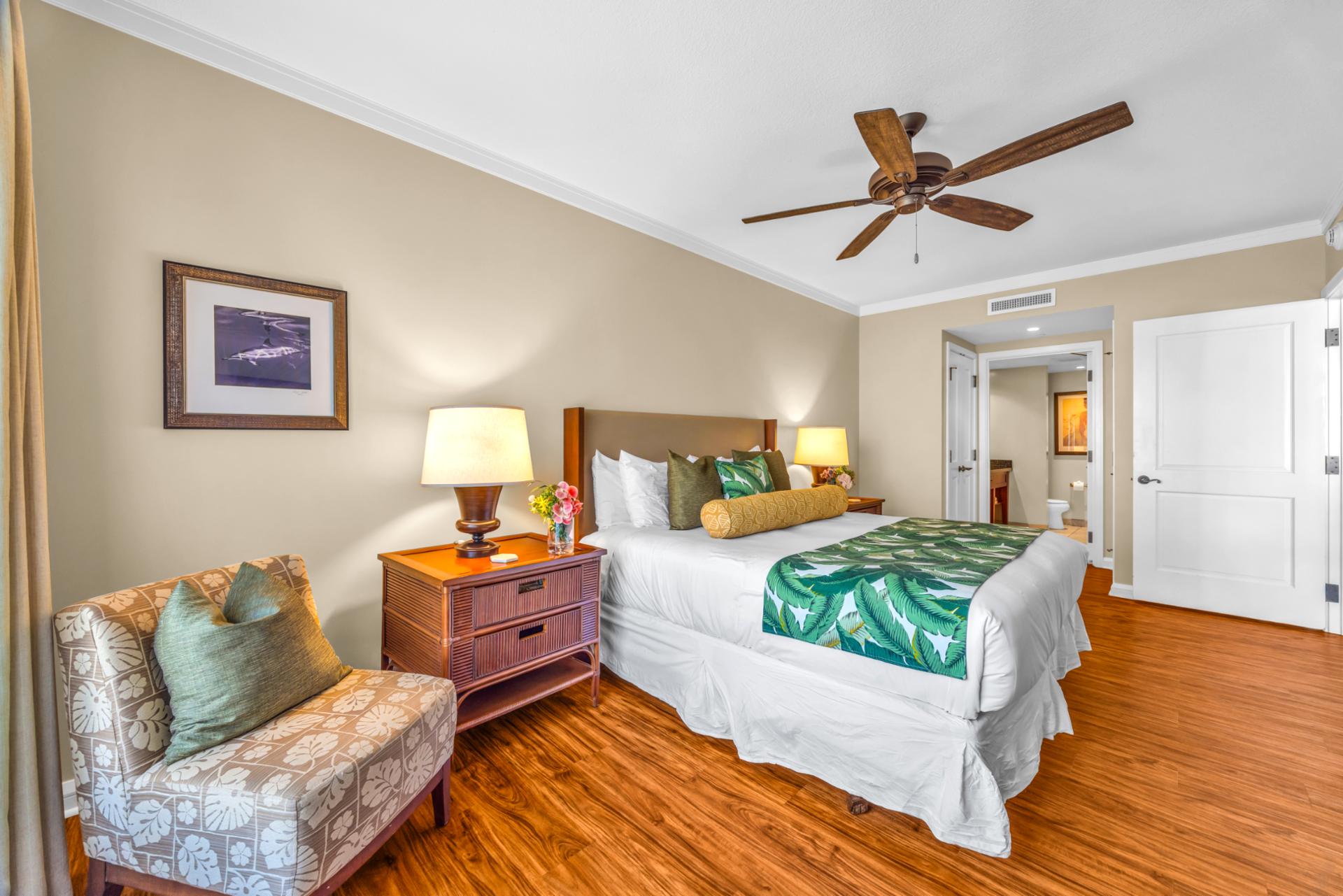 The comfortable guest room features a king size bed and luxury linens