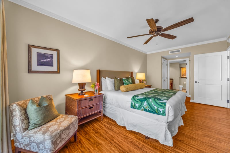 The comfortable guest room features a king size bed and luxury linens