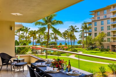Shaded lanai seating invites reading, snacking, and cool trade-wind breaks between pool sessions