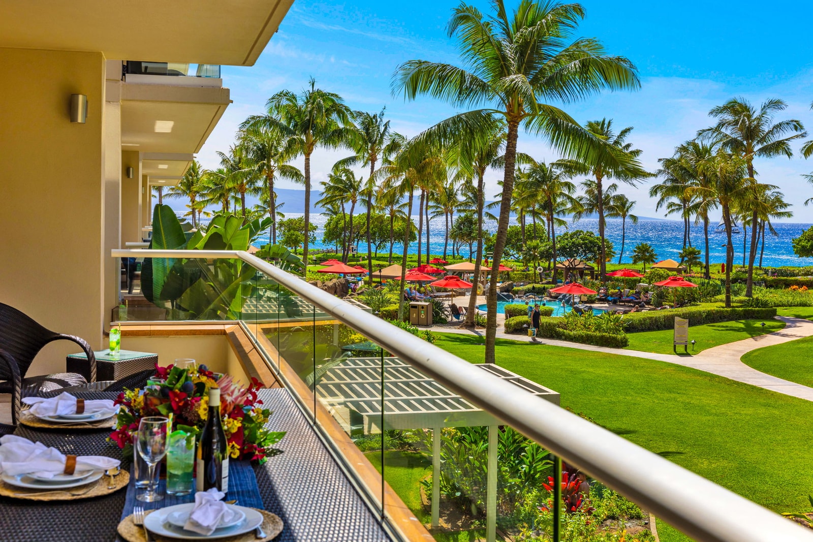 Dine alfresco on the lanai with lush landscaping and ocean glimpses, a nightly Maui ritual