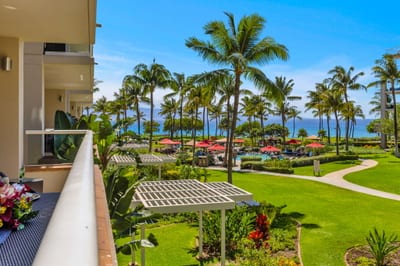 Sip sunset cocktails on the covered balcony wile palms sway along the Kaanapali shoreline
