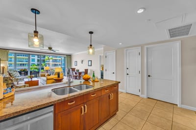 The large kitchen island doubles as a prep zone and breakfast bar for family breakfast before the beach