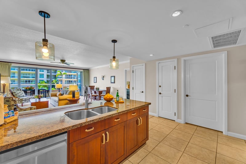 The large kitchen island doubles as a prep zone and breakfast bar for family breakfast before the beach