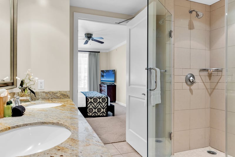 Spa inspired bathroom with dual vanities, walk i shower, and soaking tub welcomes post-beach unwinding