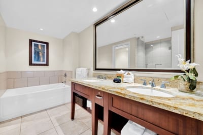Spacious guest bath with roomy vanity and tub-shower combo ideal for families