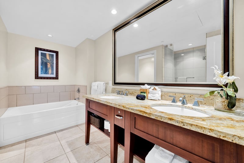 Spacious guest bath with roomy vanity and tub-shower combo ideal for families