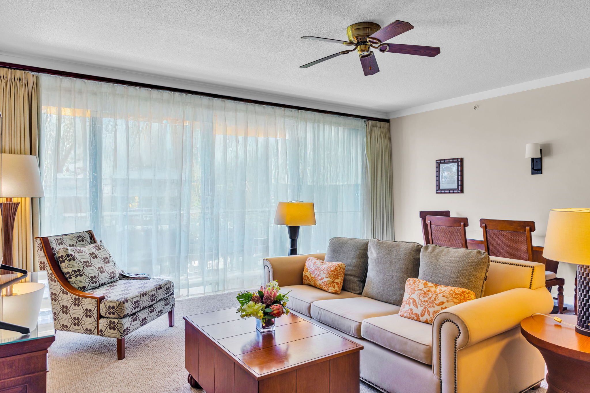 Relax in the bright living room with garden views and breezy downtime after beach adventures 