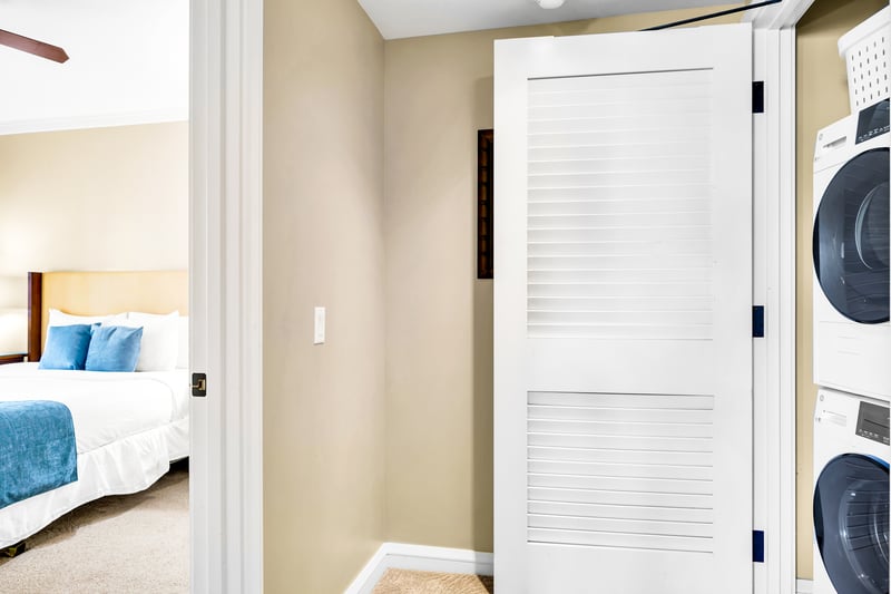 Tuck laundry neatly away behind closed doors, keeping the hallway clean and your suite feeling organized throughout your stay.