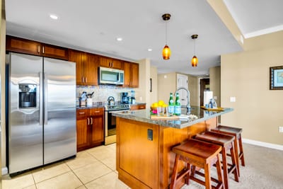Cook with stainless appliances and generous counter space, so weeknight meals and fresh island fruit prep feel effortless.