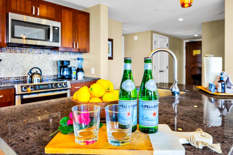 Mix a round at the kitchen counter with room for snacks and drinks, then drift into the living area for conversation.