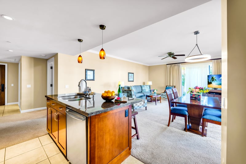 Flow from kitchen to living with ease, with bright finishes that keep the space feeling airy from coffee to cocktails.