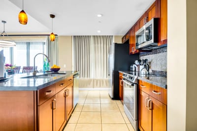 Rinse, chop, and serve with a full-size sink and ample workspace, perfect for casual meals before heading to the beach.