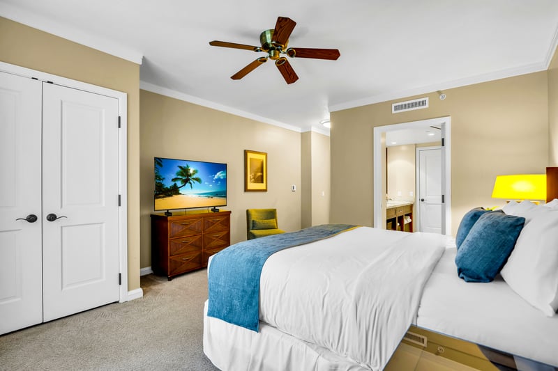 Drift off in the guest bedroom with a King bed and soft island tones, designed for comfortable sleep and easy mornings.
