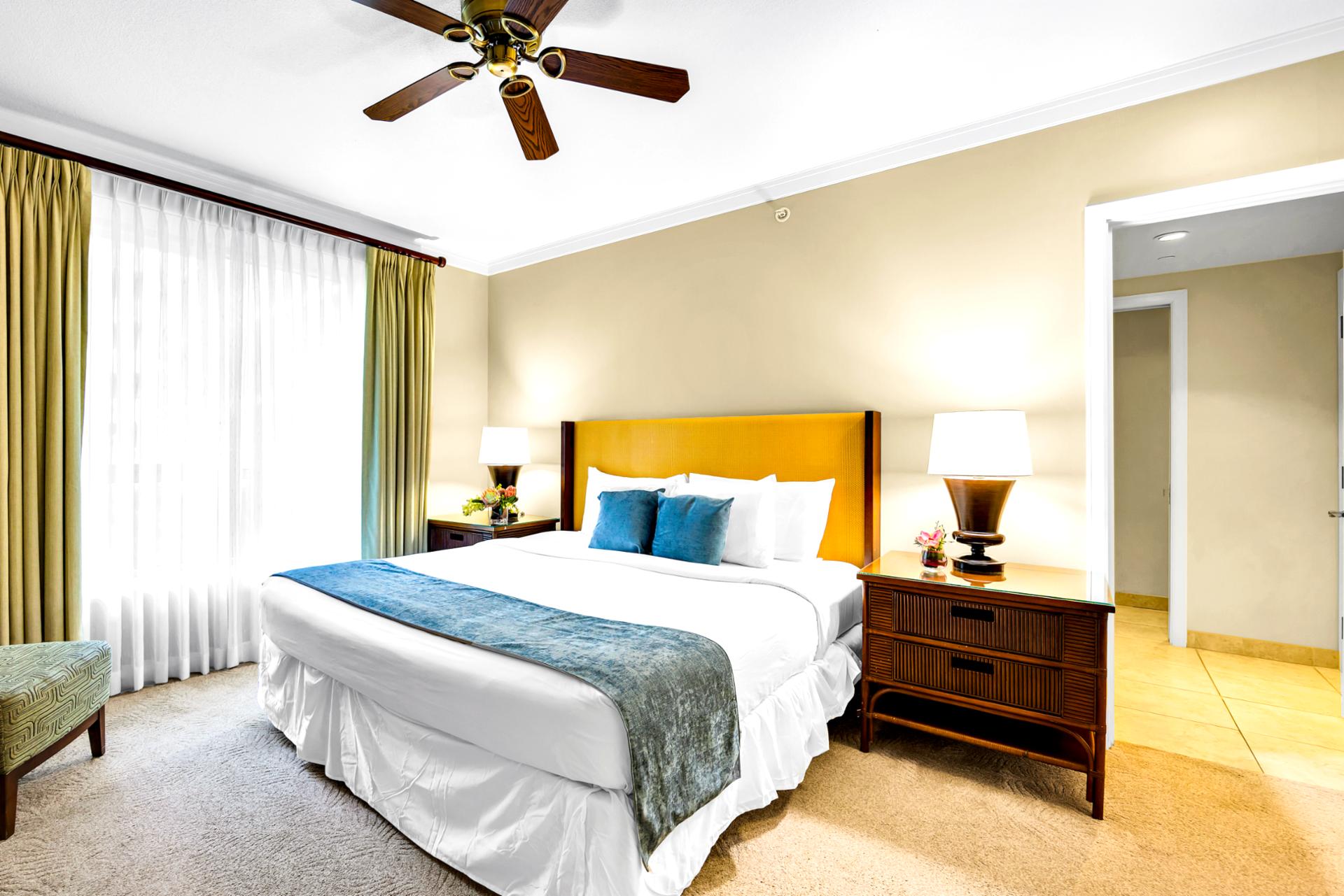 Settle into the primary King bed beneath a ceiling fan, with a roomy layout that keeps bedtime quiet and uncluttered.