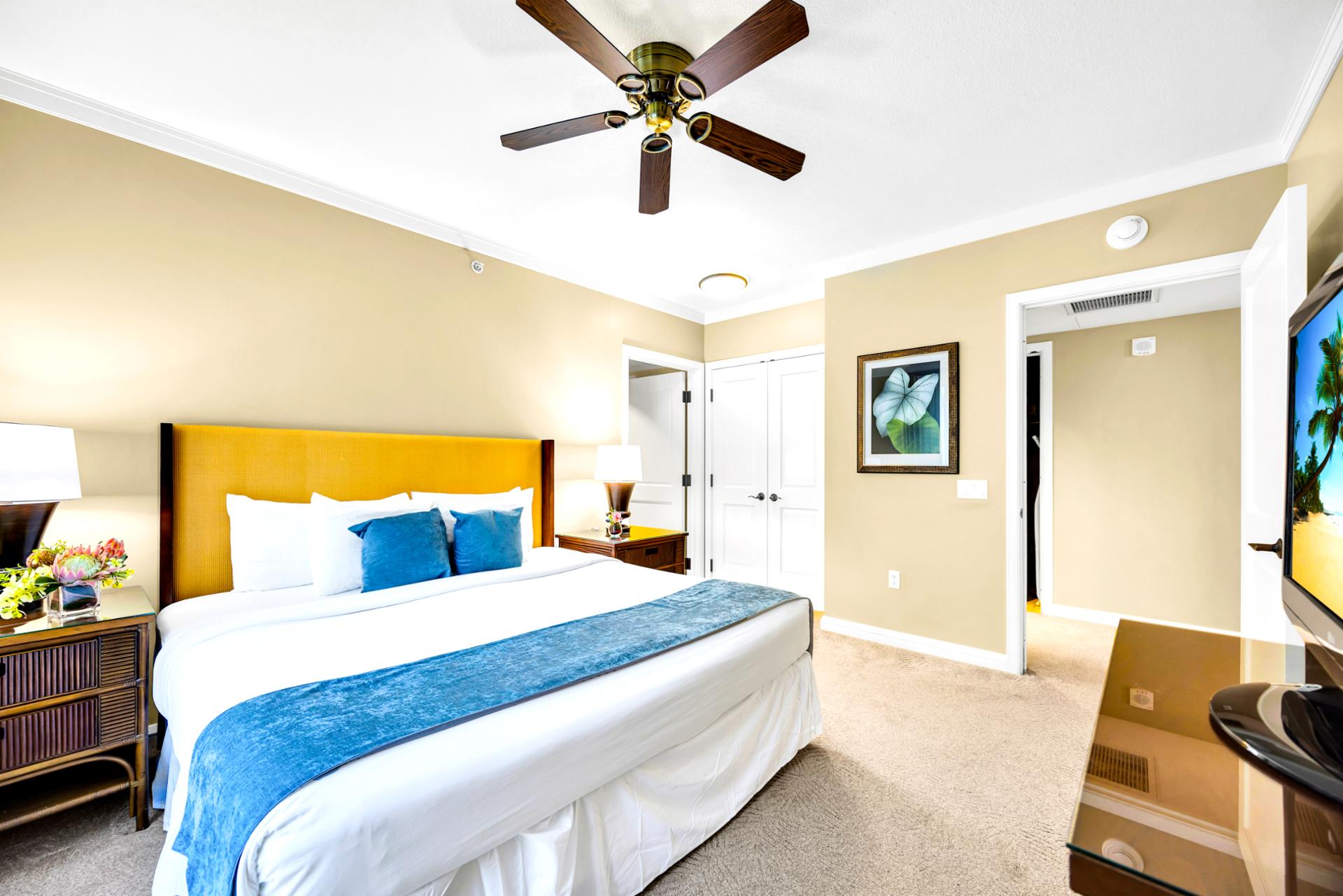 Unplug in the primary bedroom with a King bed and ceiling fan, a calm retreat for winding down after a day outside.
