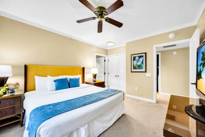 Unplug in the primary bedroom with a King bed and ceiling fan, a calm retreat for winding down after a day outside.