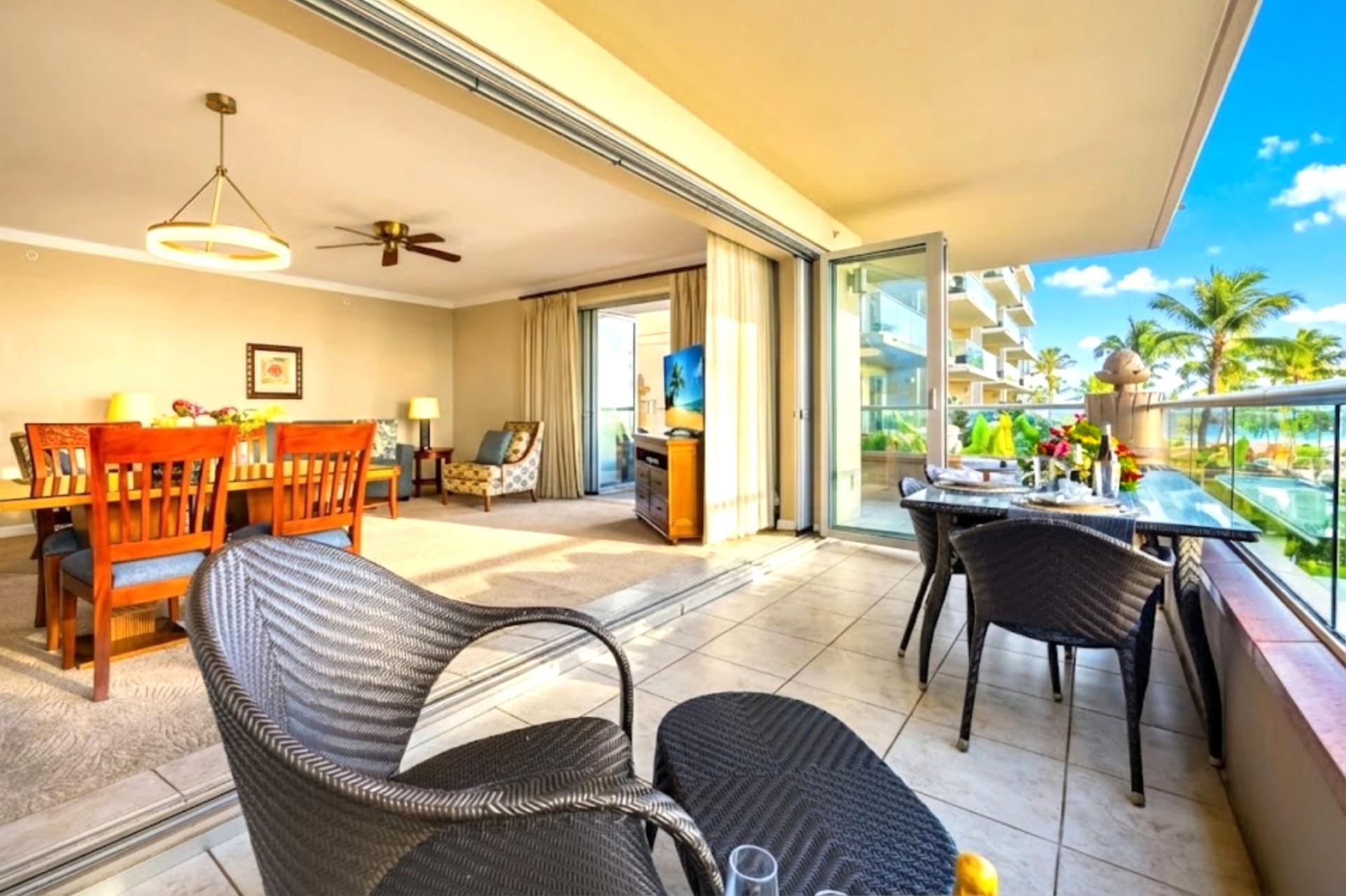 Lounge in the open living room with plush seating and easy lanai access, so indoor comfort meets island breezes in seconds.
