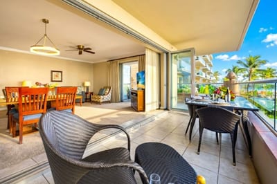 Lounge in the open living room with plush seating and easy lanai access, so indoor comfort meets island breezes in seconds.
