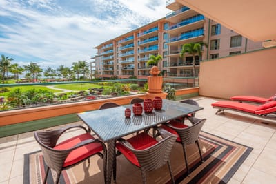 Spacious lanai dining with lush views, ocean breeze, and sunshine. HKK-225