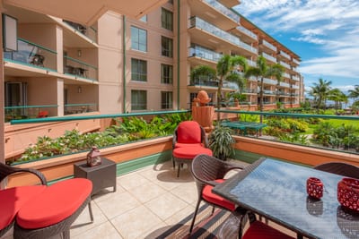 Cozy outdoor seating with lush garden and serene ocean views. HKK-225
