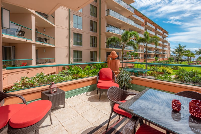 Cozy outdoor seating with lush garden and serene ocean views. HKK-225