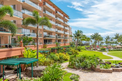 Lush tropical resort grounds with ocean views and private balconies. HKK-225