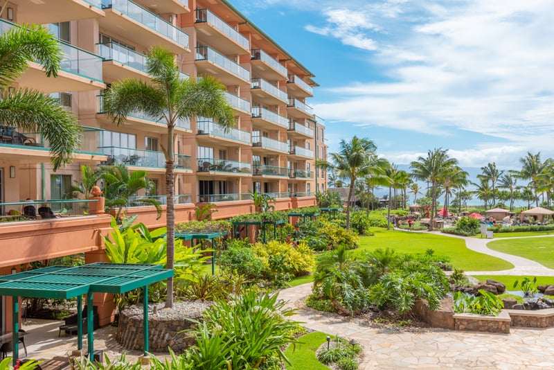 Lush tropical resort grounds with ocean views and private balconies. HKK-225