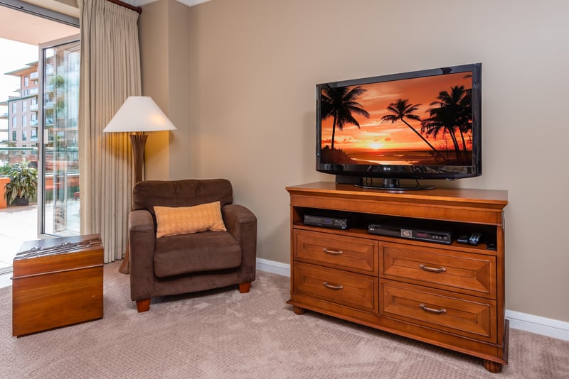Cozy media nook with tropical sunset views and plush seating. HKK-225
