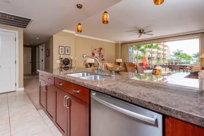 Elegant island kitchen with open living, tropical view, modern finishes. HKK-225
