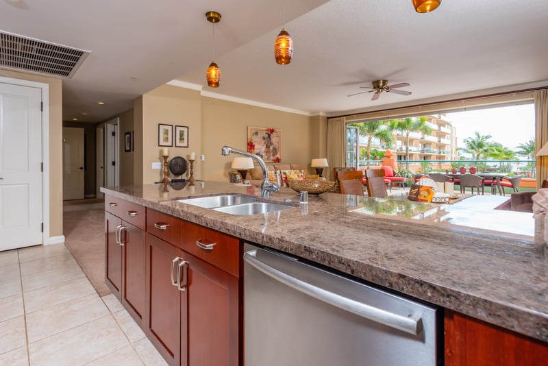 Elegant island kitchen with open living, tropical view, modern finishes. HKK-225