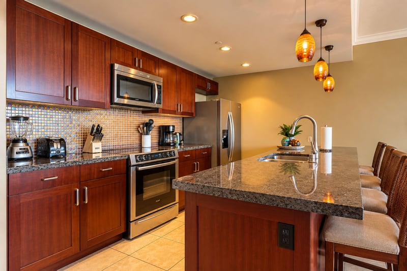 Granite counters, stainless steel appliances, and a breakfast bar with stool seating make island breakfasts and casual dinners easy to prepare. HKK-229