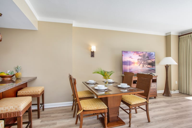 Tropical dining setting with warm tones, island fruit, and ambiance.