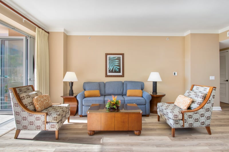 Bright, inviting living room with island-inspired furniture and warmth.